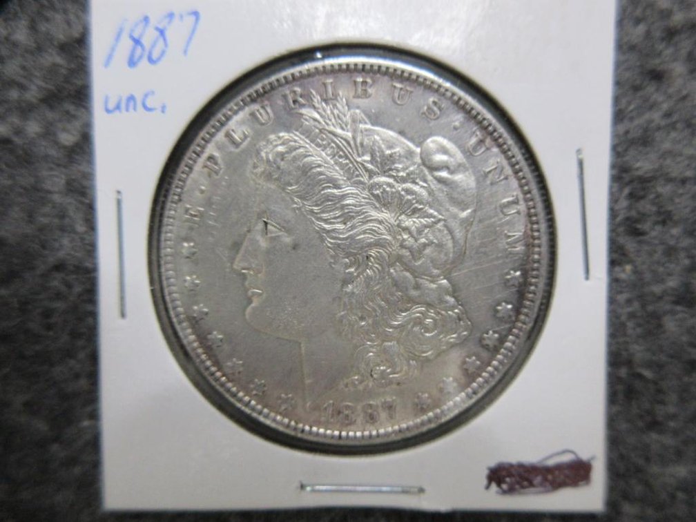 1887 Morgan dollar, AU, cleaned