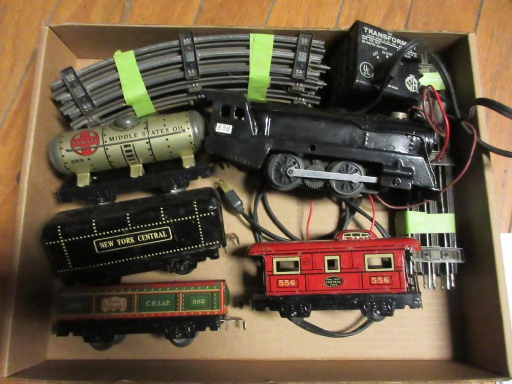 Marx Train w/ 898 engine, New York Central Lines 556 caboose & New York Central Tender, Rock Island open car 552, Santa Fe oil tanker #553, toy transformer engine transformer & pieces of track