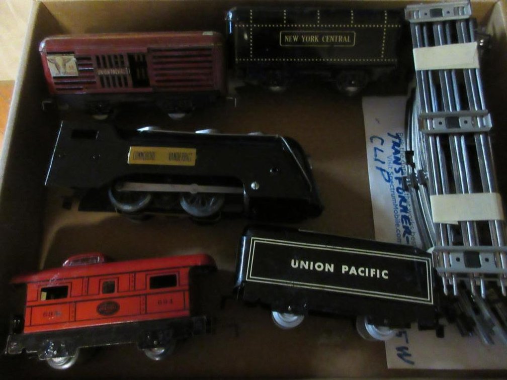 Marx engine, Commodore engine, New York Central Tender, Union Pacific Tender, New York Central caboose 649, Union Pacific livestock car