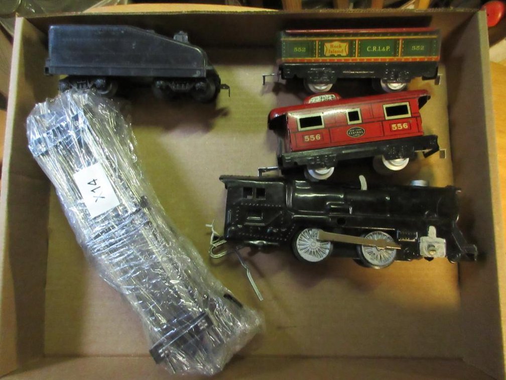 Wind-up train engine w/ Marx 556 New York Central caboose & a Marx Rock Island open car 552 & Tender & pieces of track