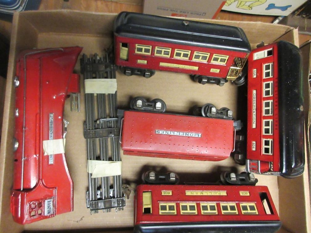 Flat of Lionel trains: Commodore Vanderbilt engine # 264-E missing the underworkings, Lionel Tender #2225T, pieces of track, caboose,  observation caboose #604 (2 of these), Pullman car #603