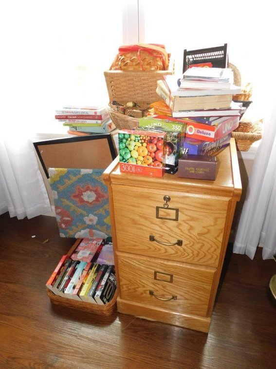 Wooden filing cabinet, games, baskets, books