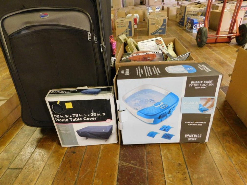 Large lot of home goods including luggage, picnic table cover, foot spa & home d�cor, etc.