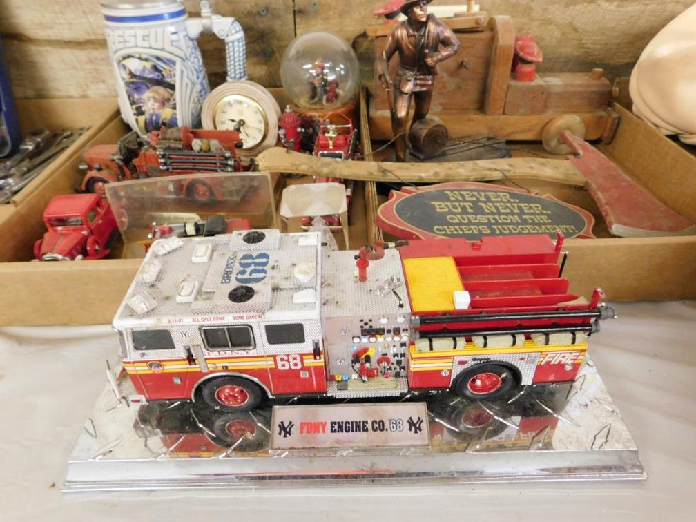 Fire fighter themed d�cor - wooden fire truck, NY Yankees FDNY Engine Co. 68 fire truck, firefighter beer stein, etc.