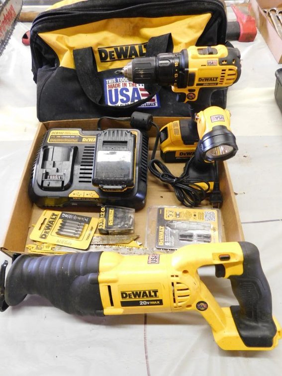 Assorted DeWalt power tools - reciprocating saw, 20 volt drill, work light, batteries, charging station, bits & blades, tool bag