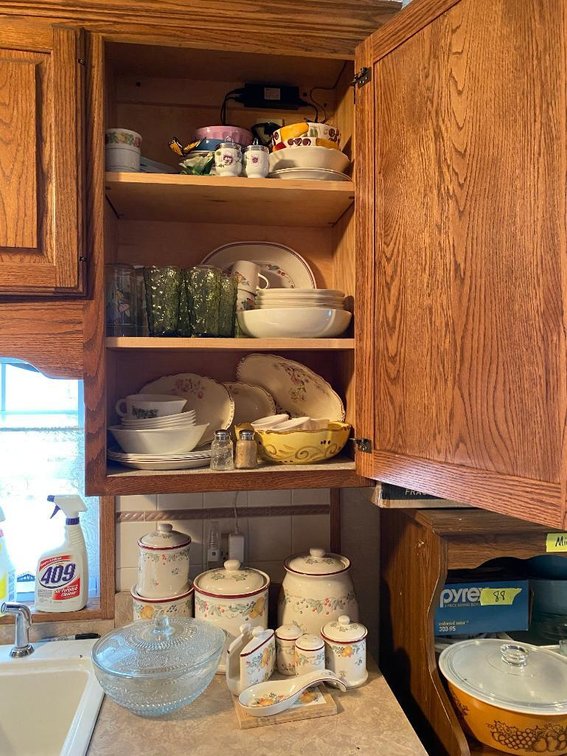 Contents cabinet and top of counter: canister set, glassware, etc