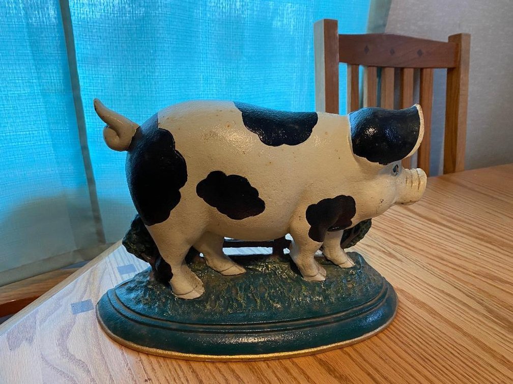 Cast iron pig door stop
