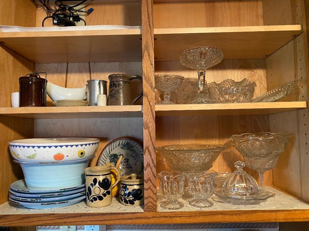 Contents top cabinet: glass, serving pieces, etc