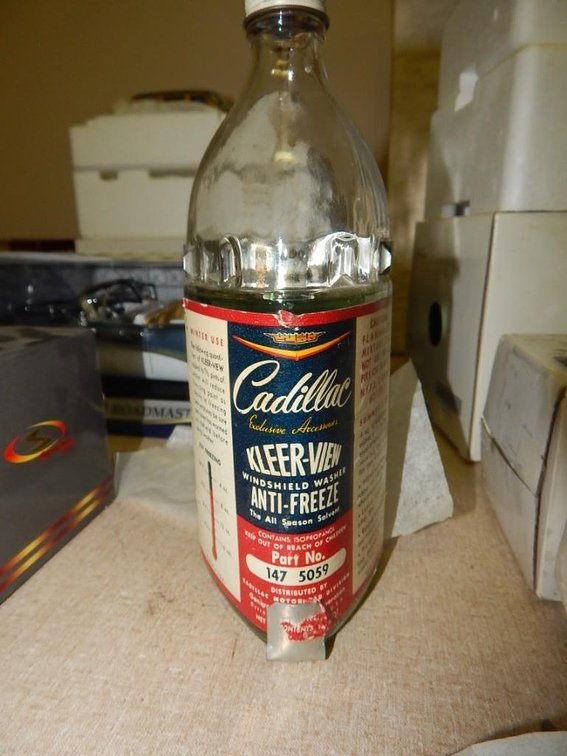 Original washer bottle w/ bracket out of Cadillac