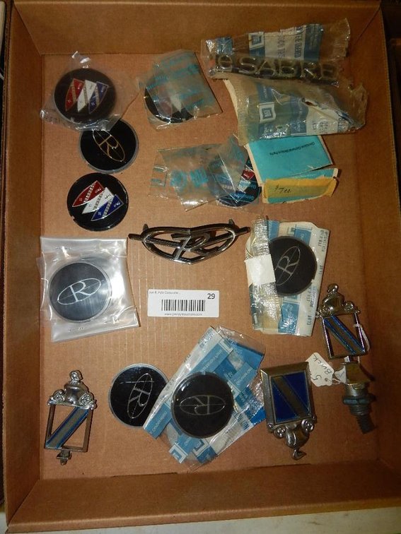 Flat of Buick Riviera emblems & inserts