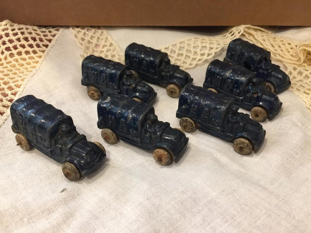 Seven Barclay slush metal Army trucks rubber wheels