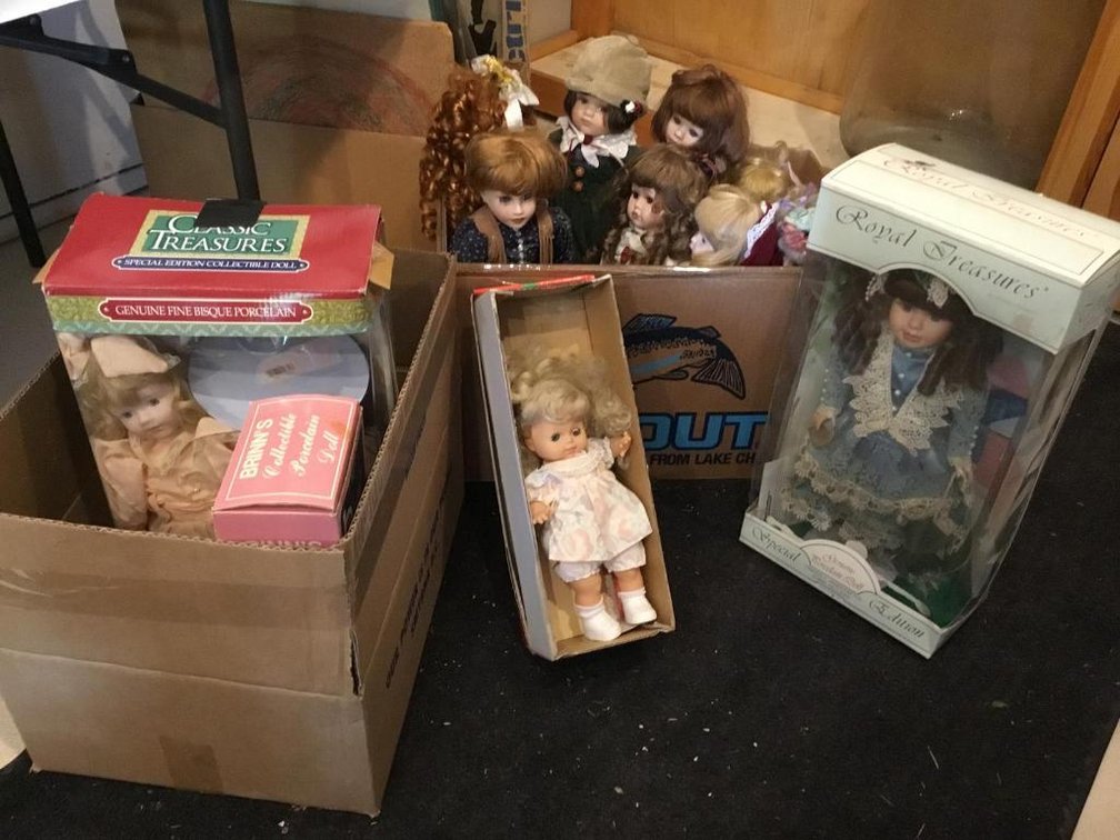 Lot of porcelain dolls, some new in box