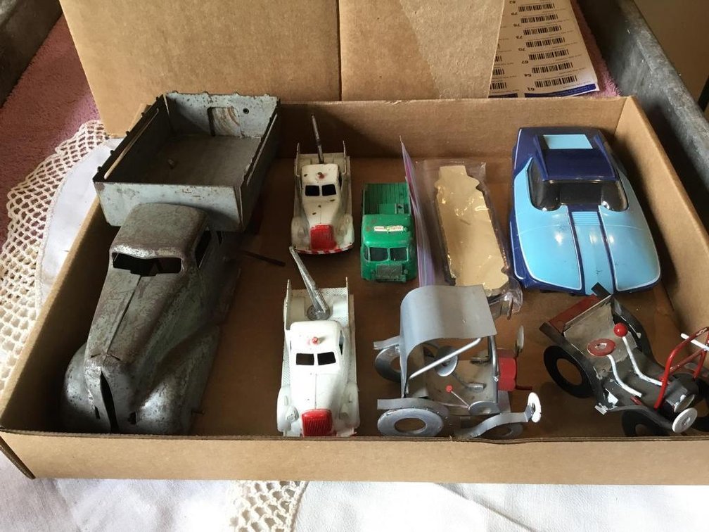 Vintage metal toy trucks and Hasbro Maze-a-Matic plastic car and accessories