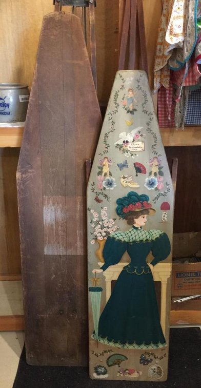 Two vintage wooden ironing boards, one hand painted with Victorian lady theme
