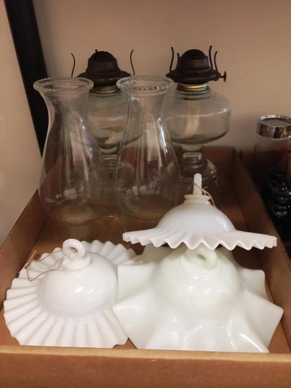 Antique oil lamps with milk glass smoke bells