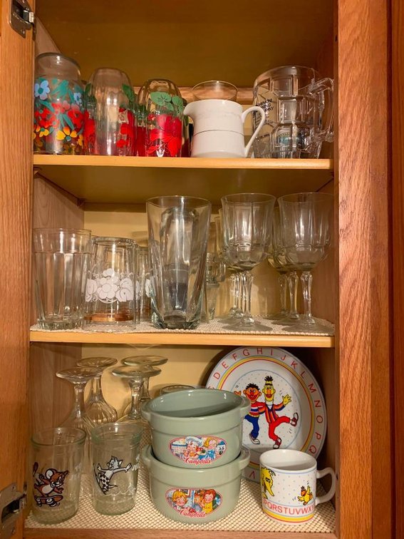 Contents of cabinet; china set, glasses, bowls