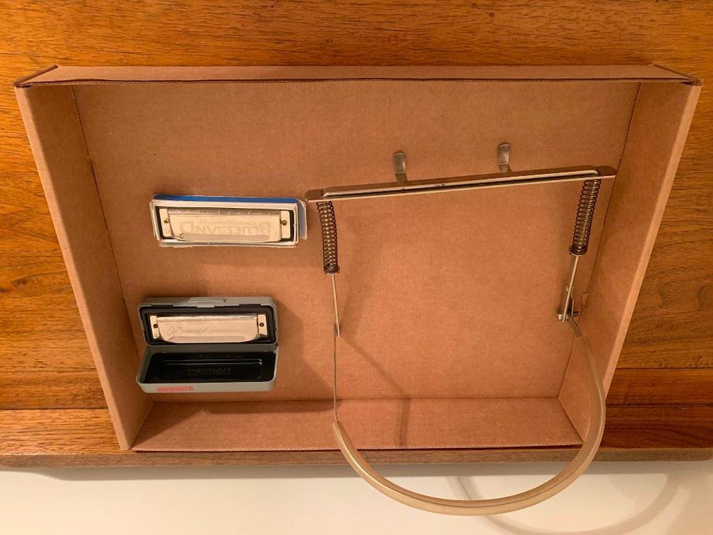 2 Hohner harmonicas w/ harmonica holder