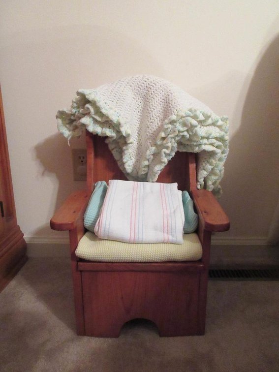 Small child's chair w/ baby blankets