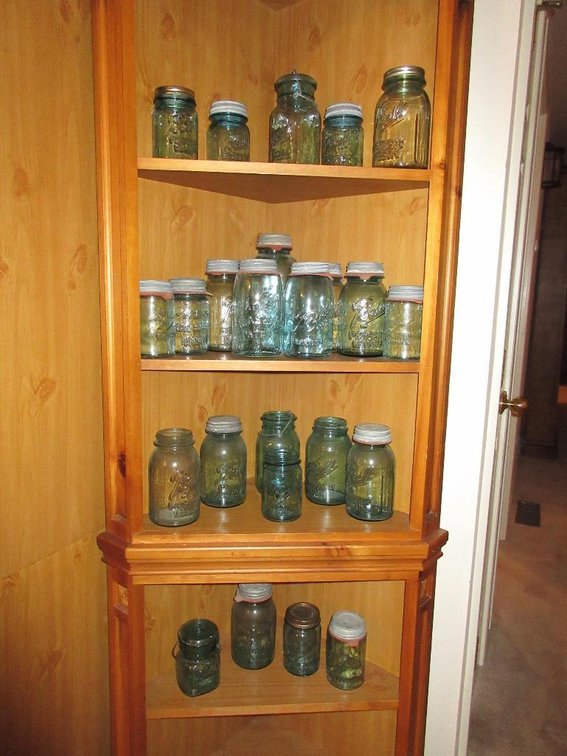 Collection of green ball canning jars some with lids