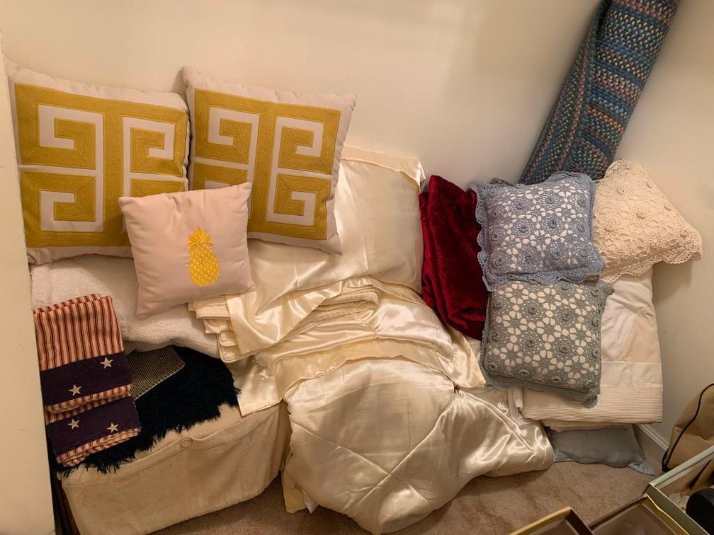 Pillows, bed spread, pillow cases, rugs, curtains, and blankets