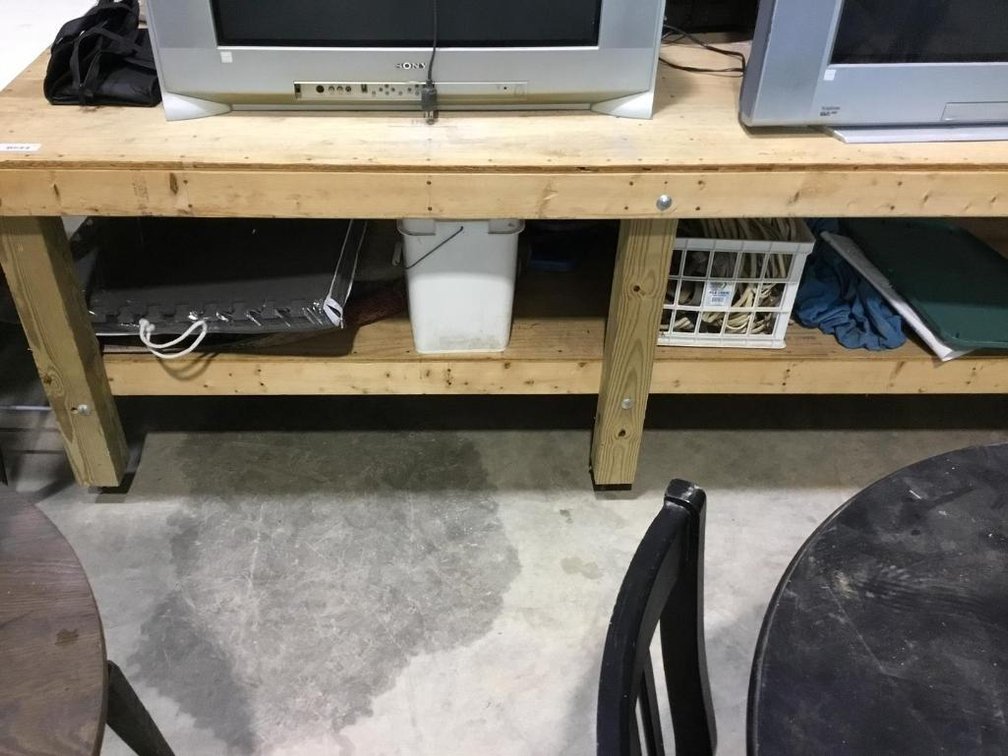 Wooden rolling bench and contents underneath