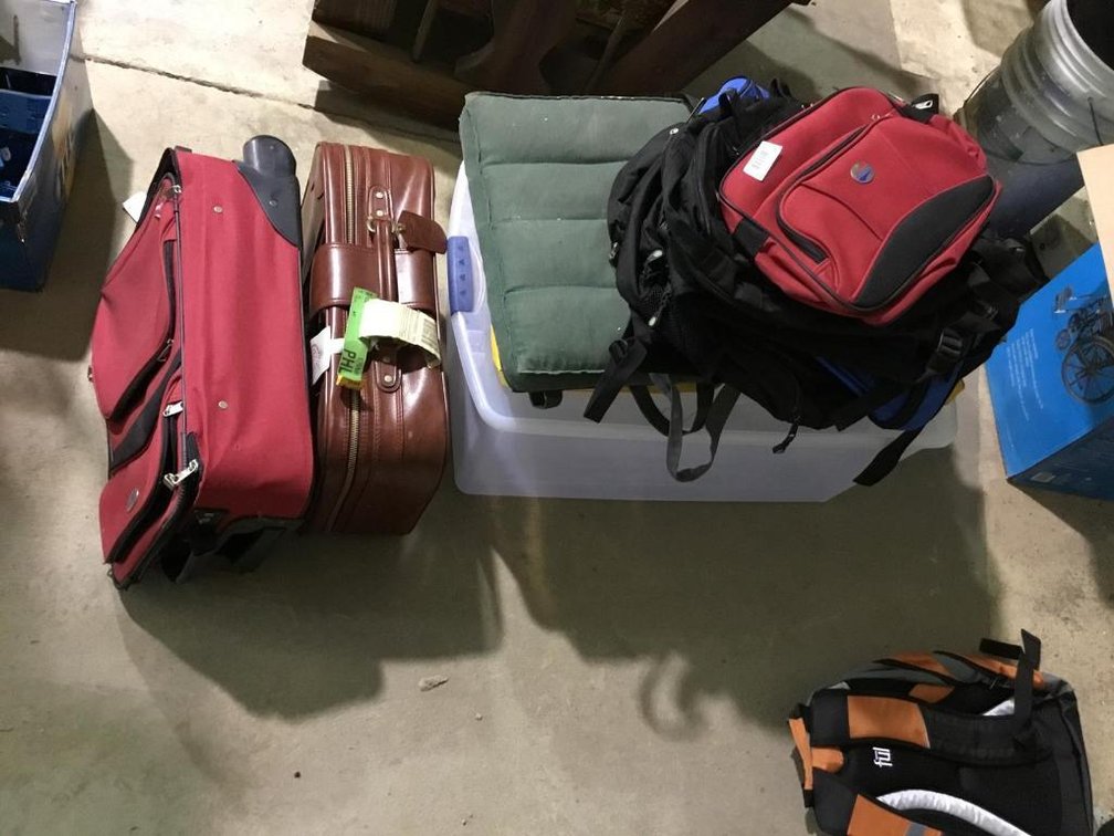 Lot of luggage and plastic tote