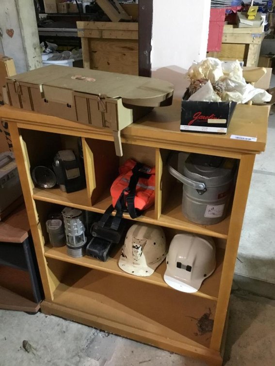 Cabinet and contents: miner's lights, hats, buckets, etc.