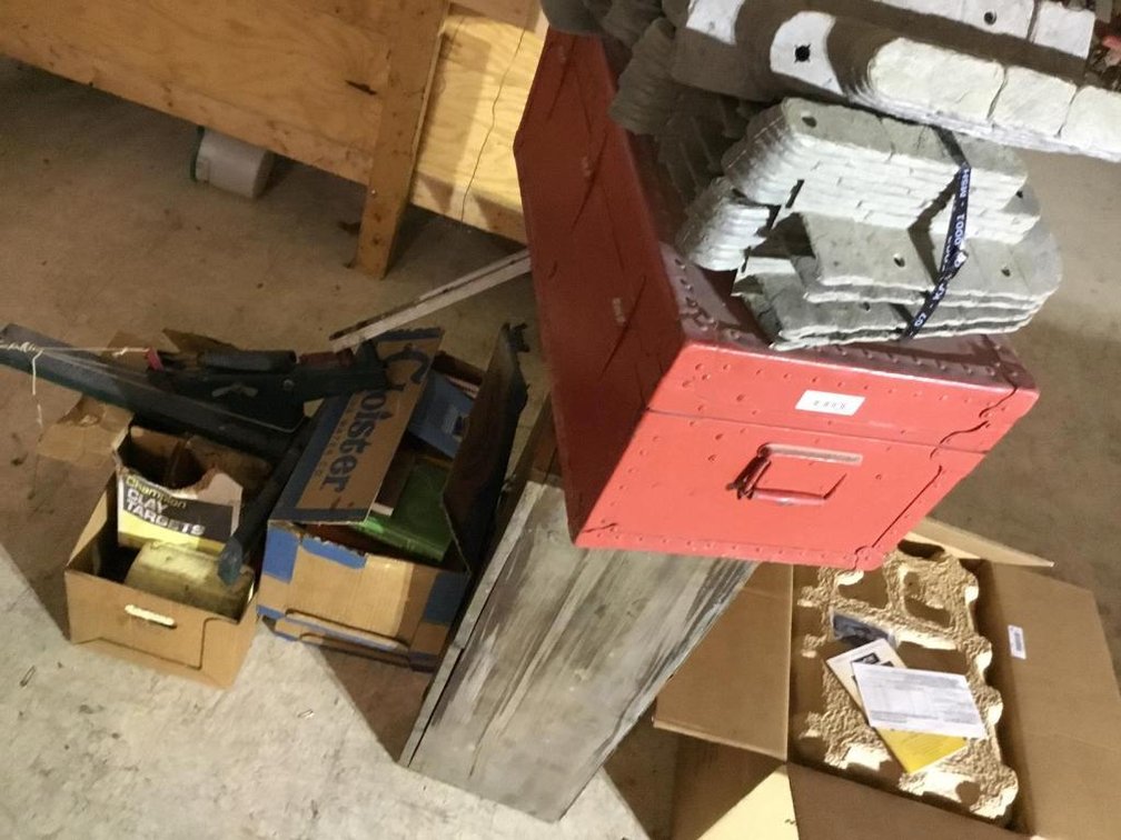 Lot of flat top trunk cabinet, books, clay throws, etc.