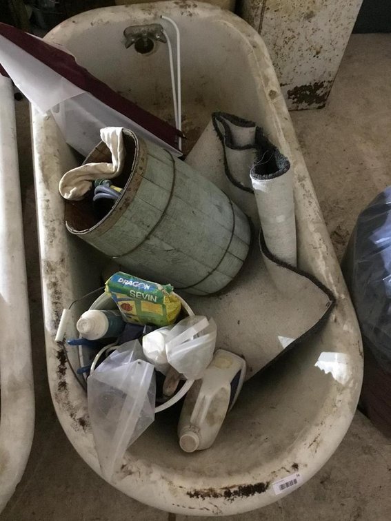 Cast iron claw foot bath tub w/ contents
