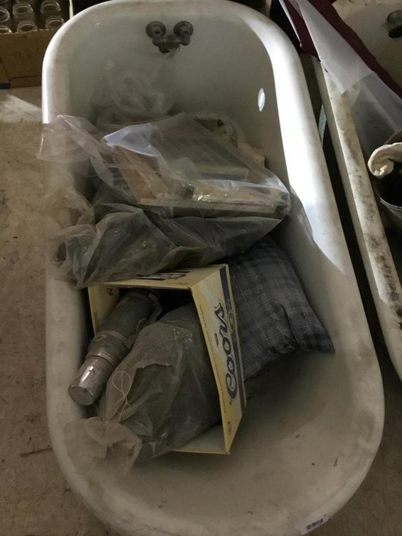 Cast iron claw foot bath tub w/ contents