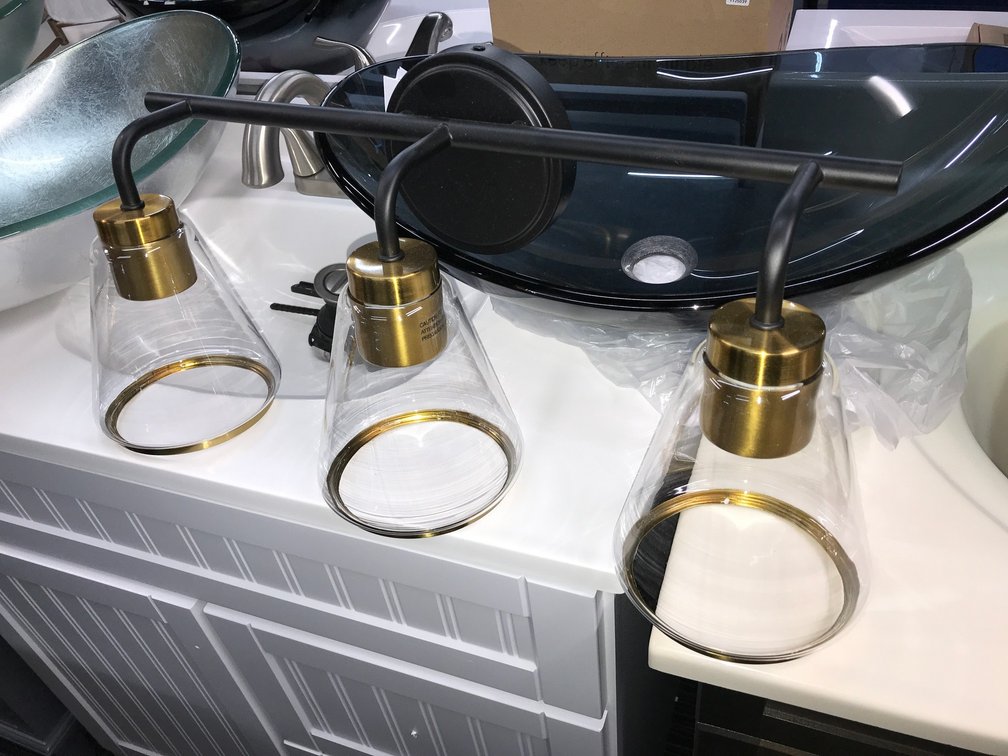 Black and gold Vessel sink and vanity light