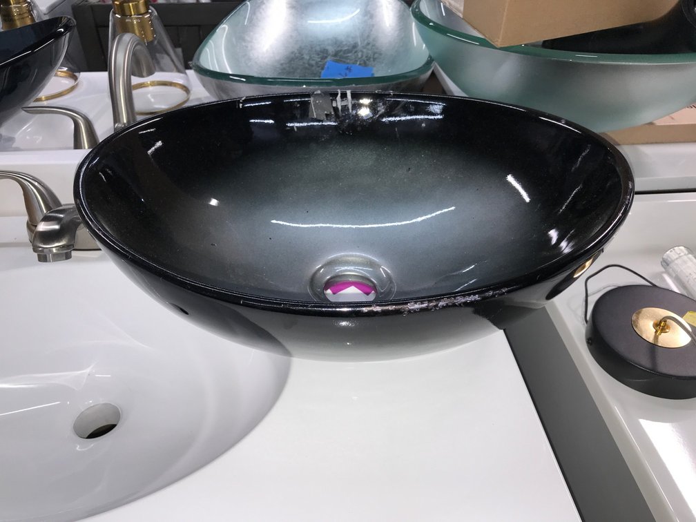 Black and gold Vessel sink and vanity light