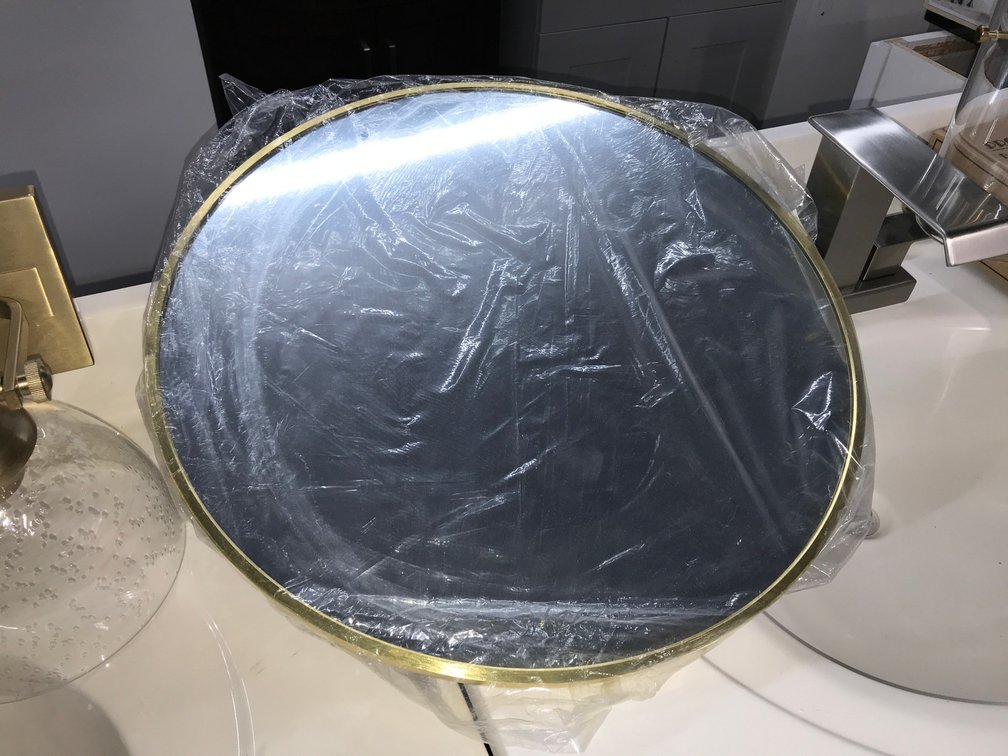 Gold round mirror