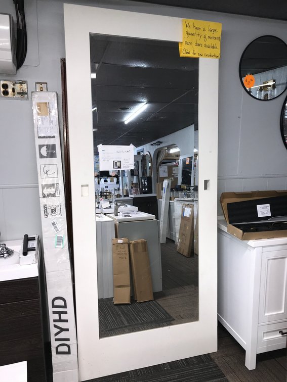 White mirrored barn door 