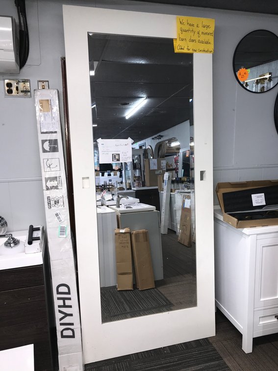 White mirrored barn door 