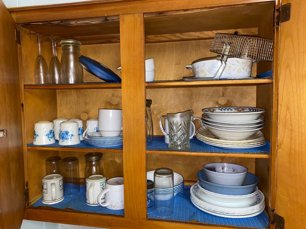 Contents of all upper cabinets:  Dishes, bowls, Corning cookware