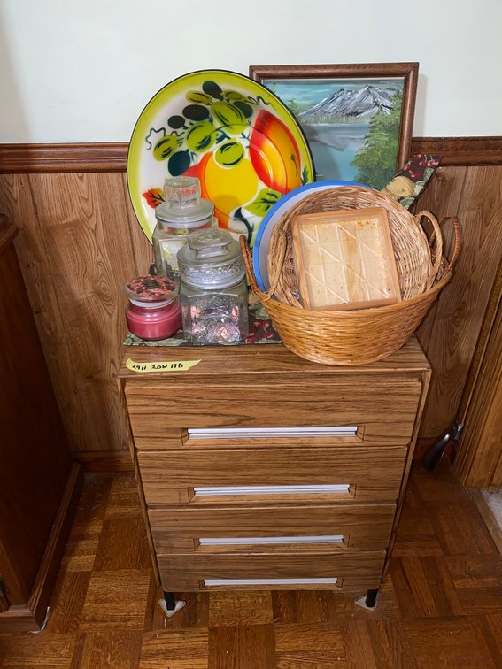 Small cabinet w/ storage jars, baskets, painting