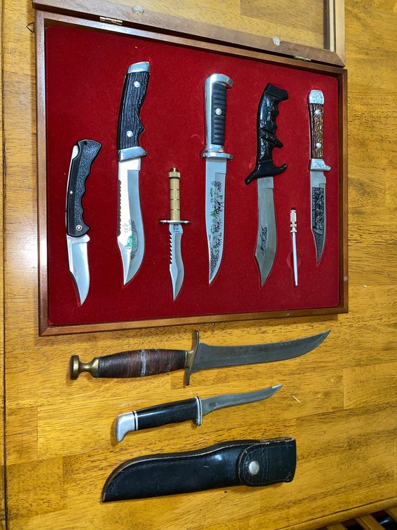 Buck knife in sheath, collectible knives in case w/ decorated blade