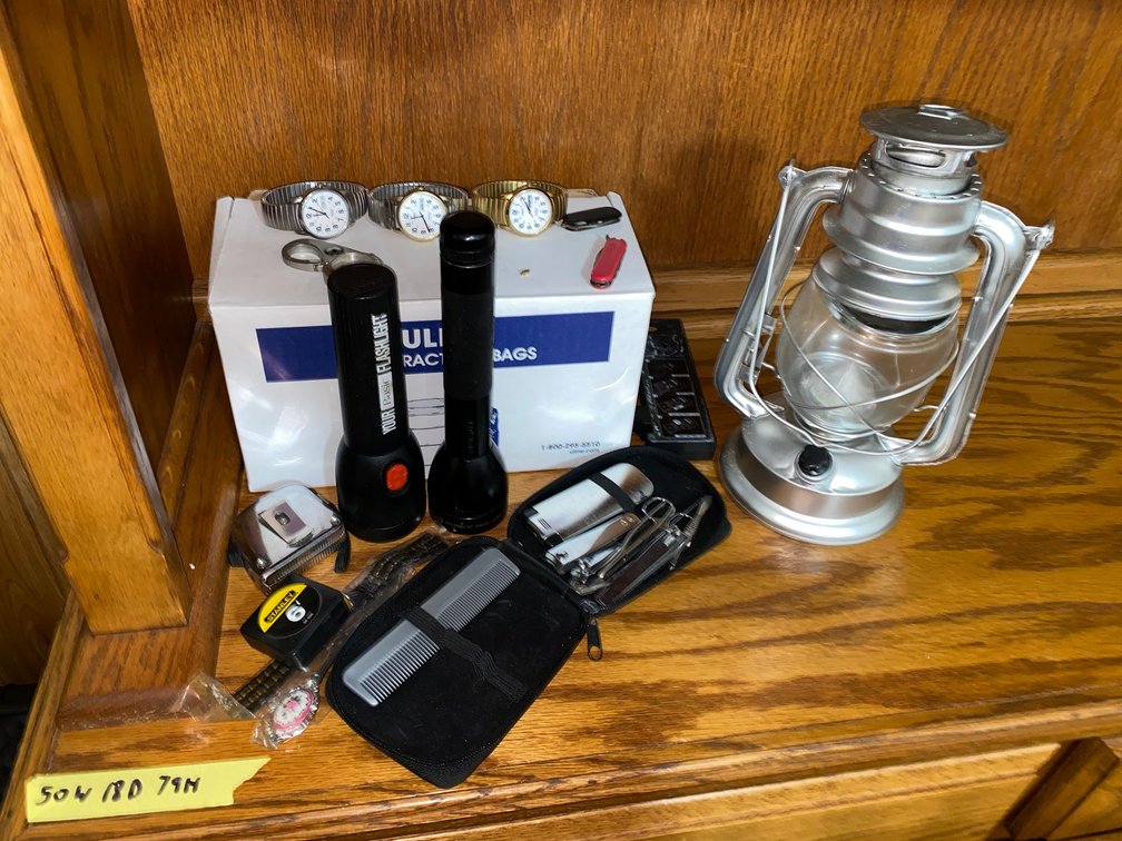 Men's wrist watches by Timex, measuring tapes, lantern and flashlights