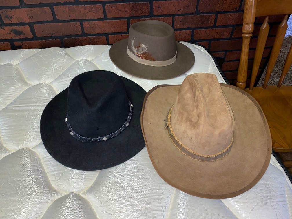 Men's hats; black hat 100 percent wool, dark brown hat small/medium, light brown Stetson is size 7-1/4