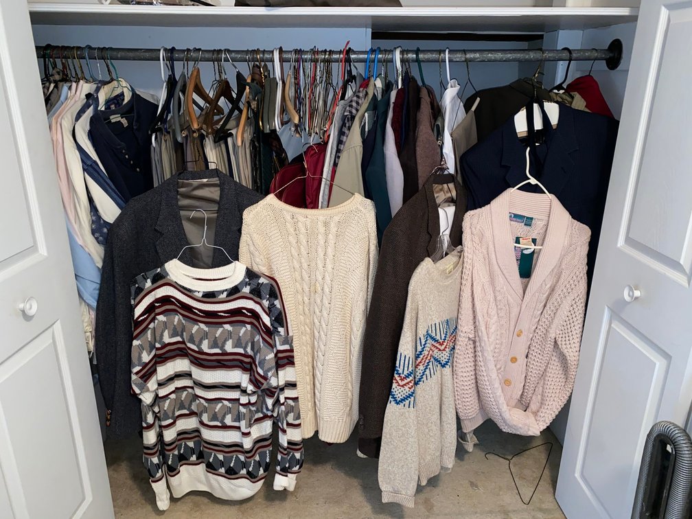 Contents of closet:  Sweaters, coats, jackets, pants in XX sizes