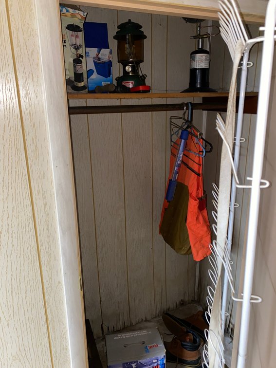 Contents of closet:  Propane lantern, gun cleaning kit, Grill Combo