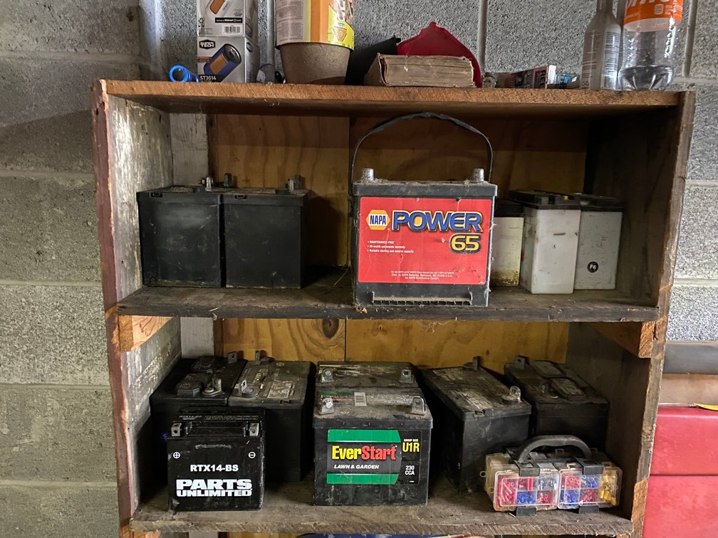 2 Shelves of batteries and 1 shelf of misc.