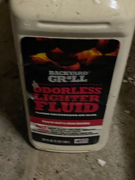 Grill lighter fluid (5 full bottles) and a gallon of chainsaw bar oil