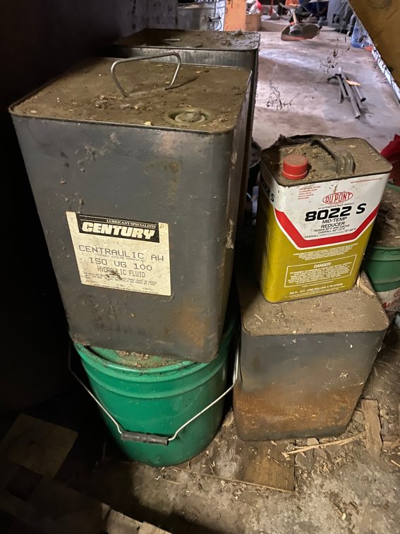 Buckets of hydraulic fluid, age unknown