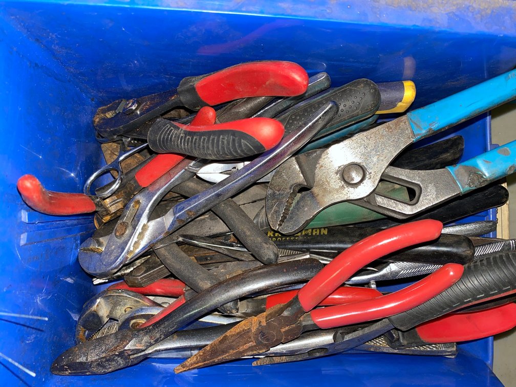 Little container of assorted pliers
