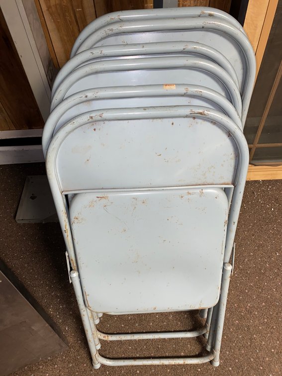 Metal shelf and six metal chairs