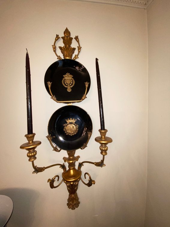 Contemporary decorative accessory pair of gilt decorative wall hung sconces set with porcelain plates