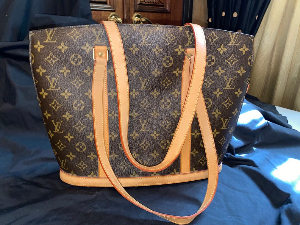Louis Vuitton bag with shoulder strap and storage bag