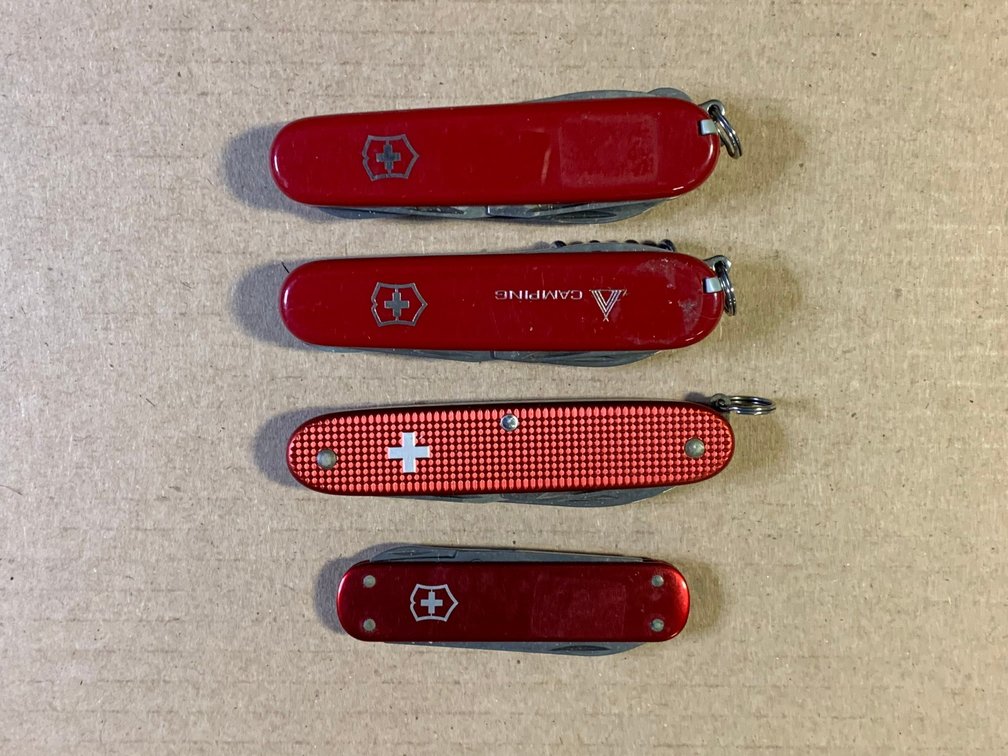[66] Four Vicotorinox Multi Blade Knive